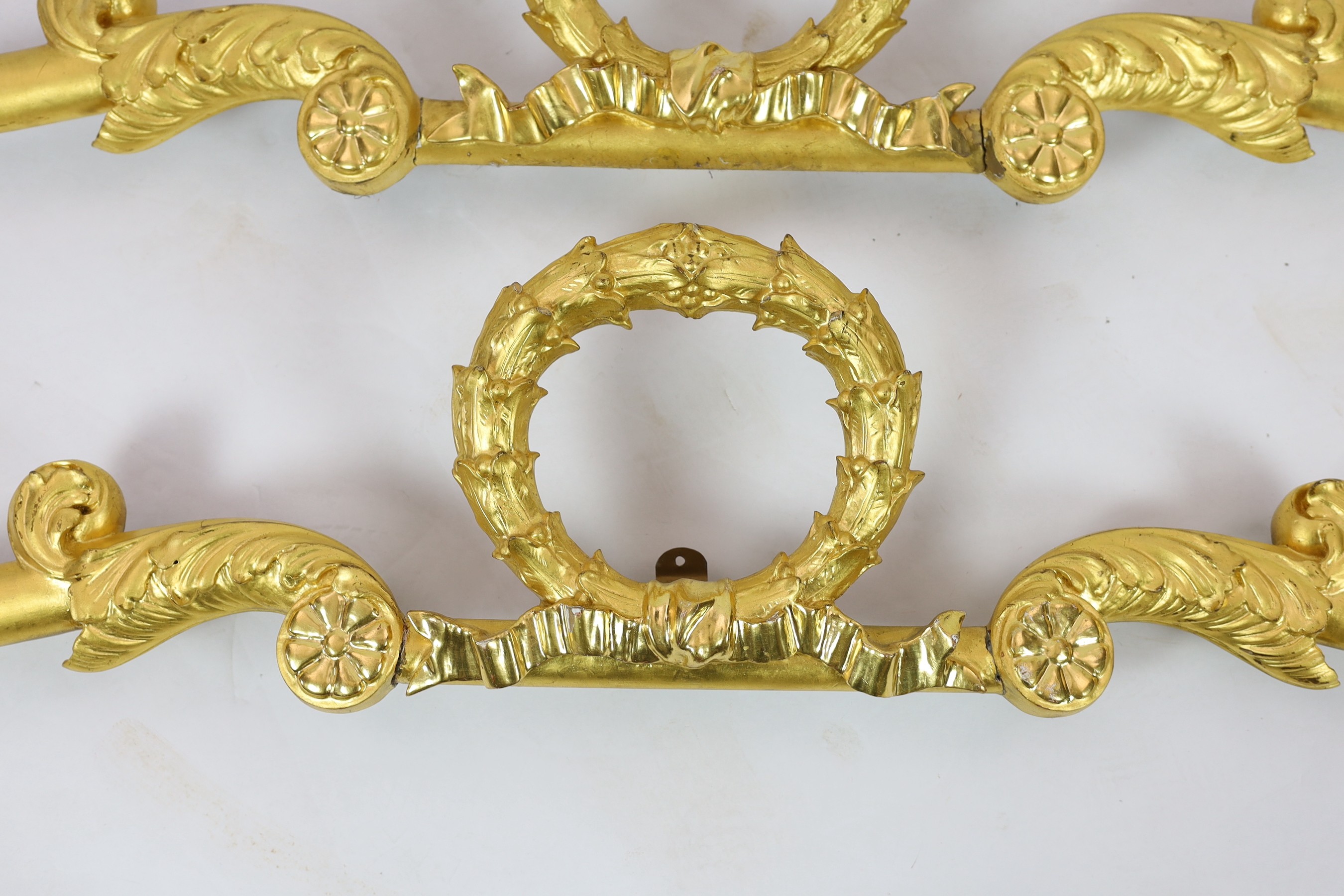 A pair of mid 19th century giltwood pediments, W.180cm H.30cm